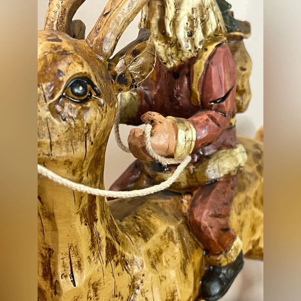 Primitive Folk Art Santa riding Reindeer 12”‎ tall chiseled resin faux wood